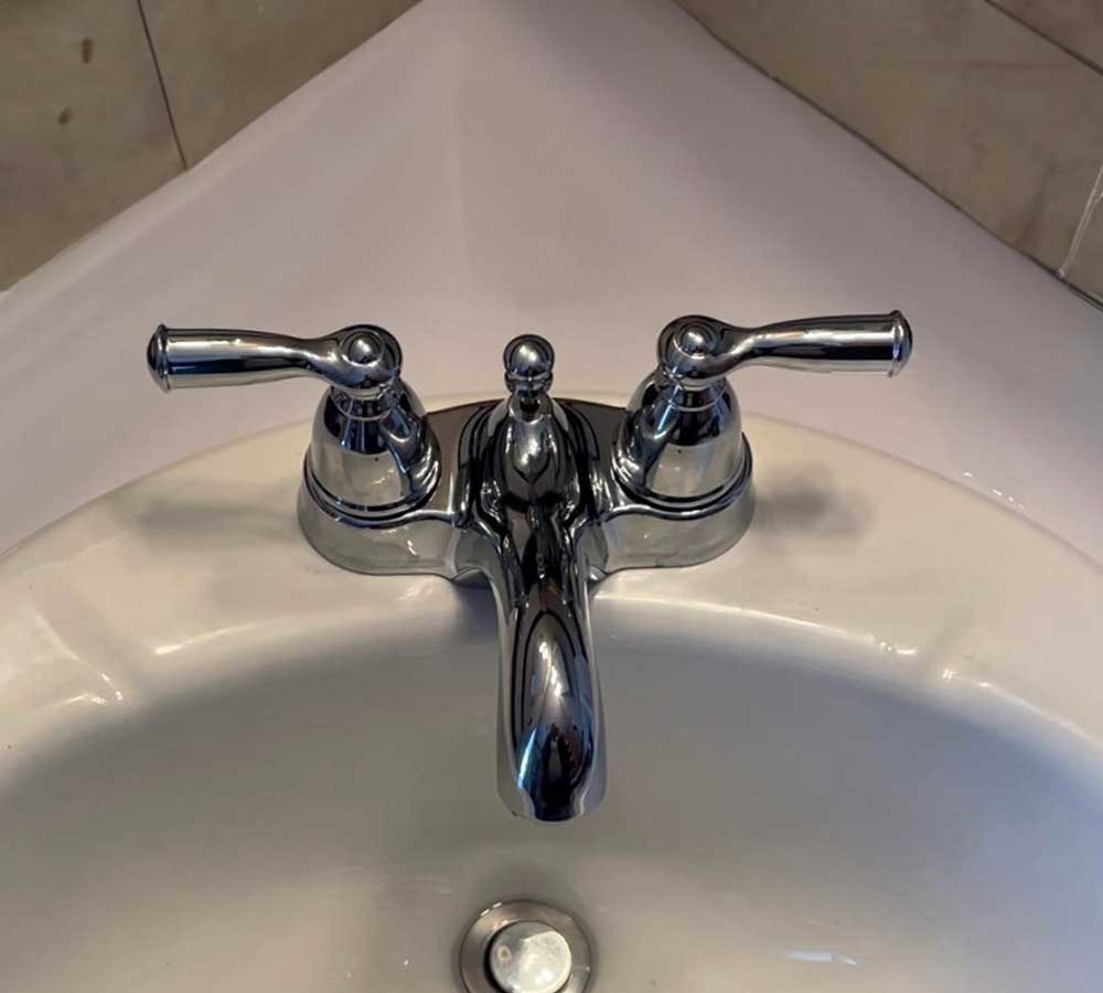Installed bathroom faucet and sink plumbing in a South Shore home