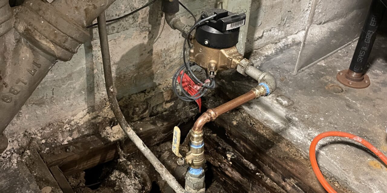 Replace leaking water main in Roslindale, Boston