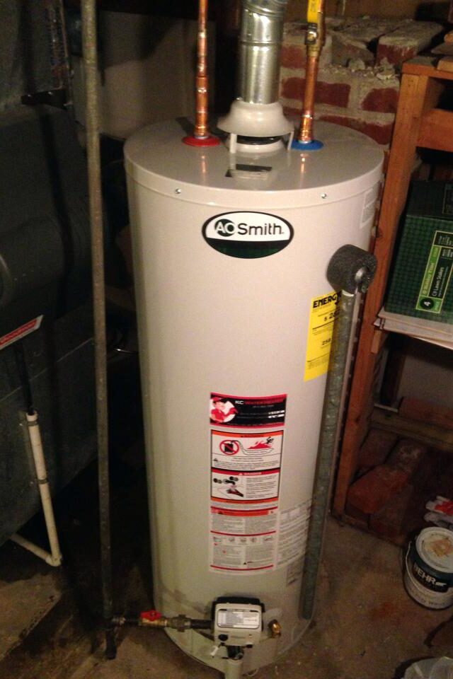 Leaking AO Smith water heater in Quincy, MA identified and repaired by Johnson Bros. Plumbing & Drain Cleaning.