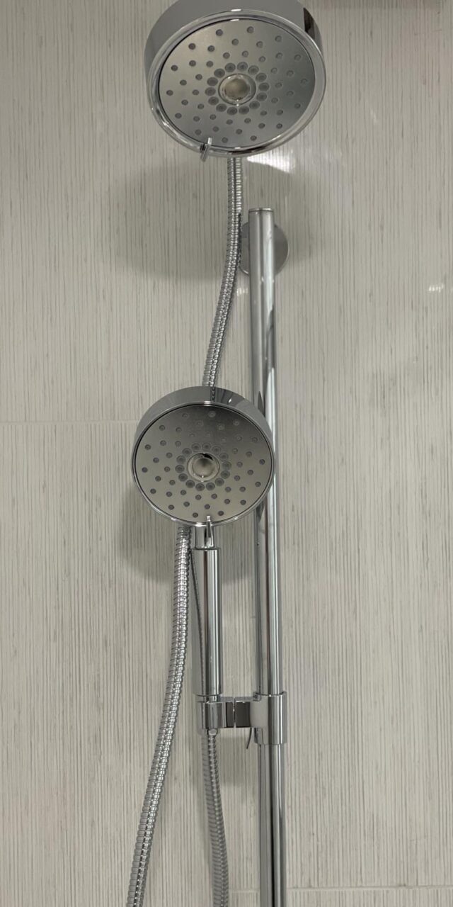 Dual showerhead setup featuring a Symmons shower valve for enhanced functionality and style.